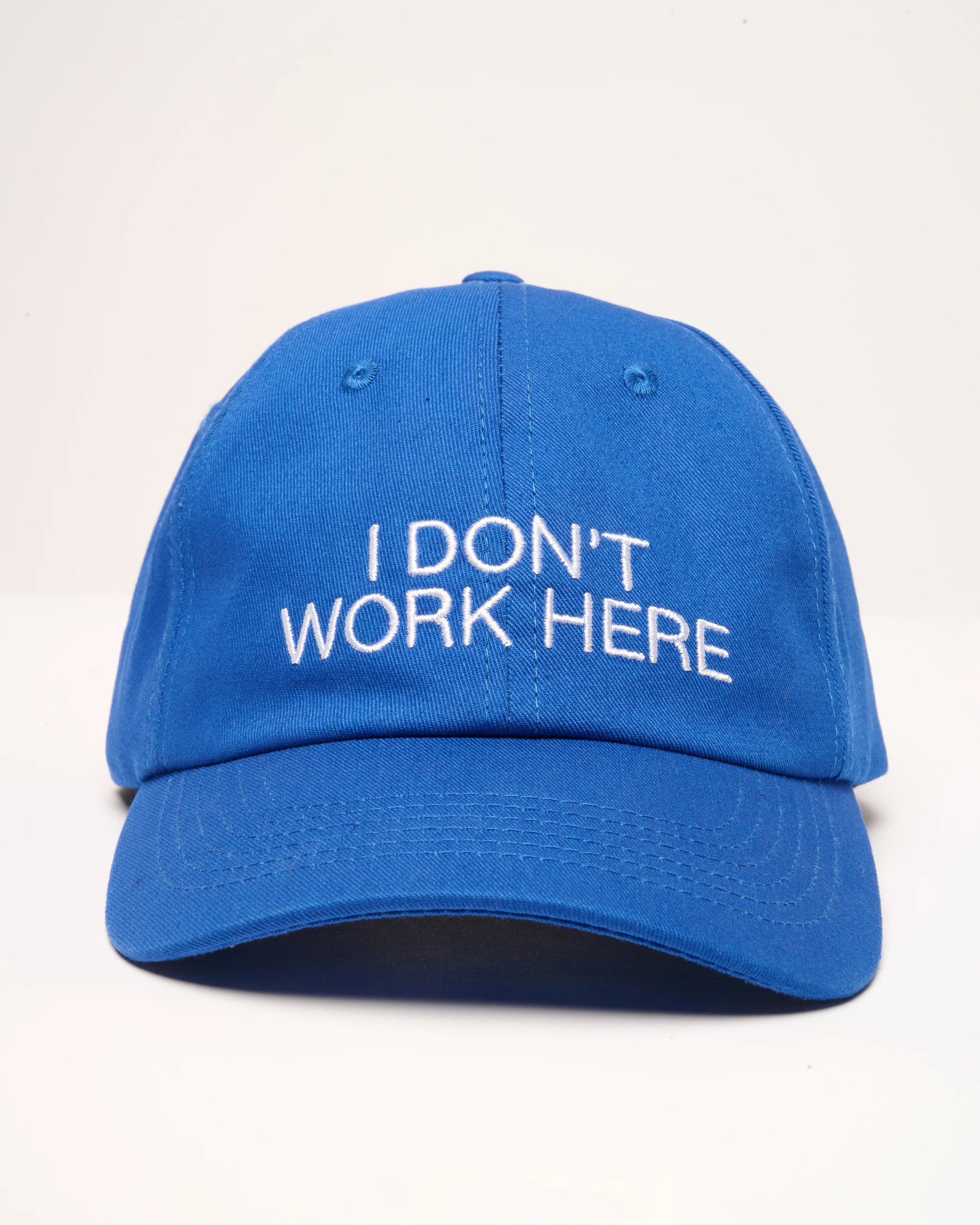 I Don't Work Here Hat with embroidered slogan on front
